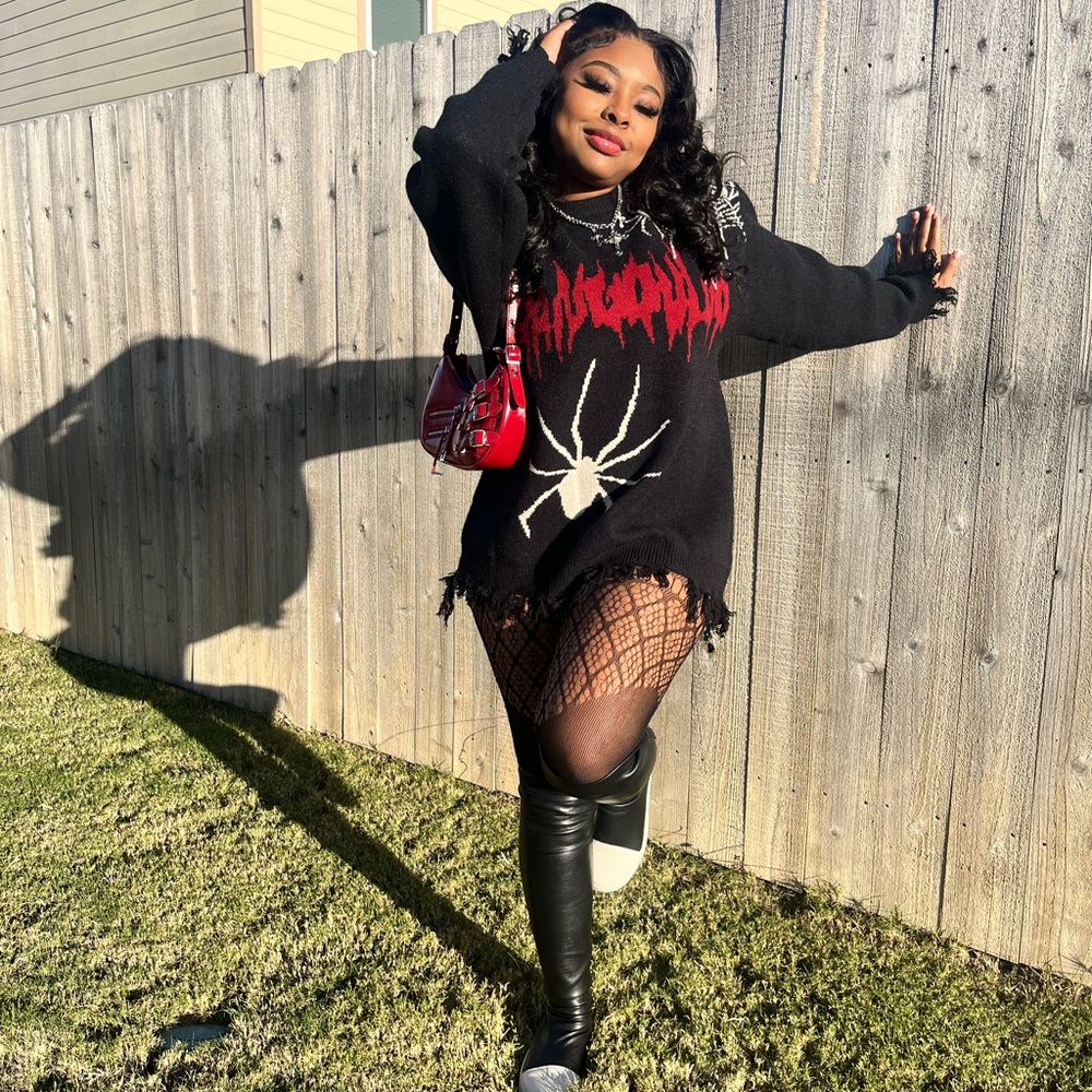 Large black sweater with cream & red decal